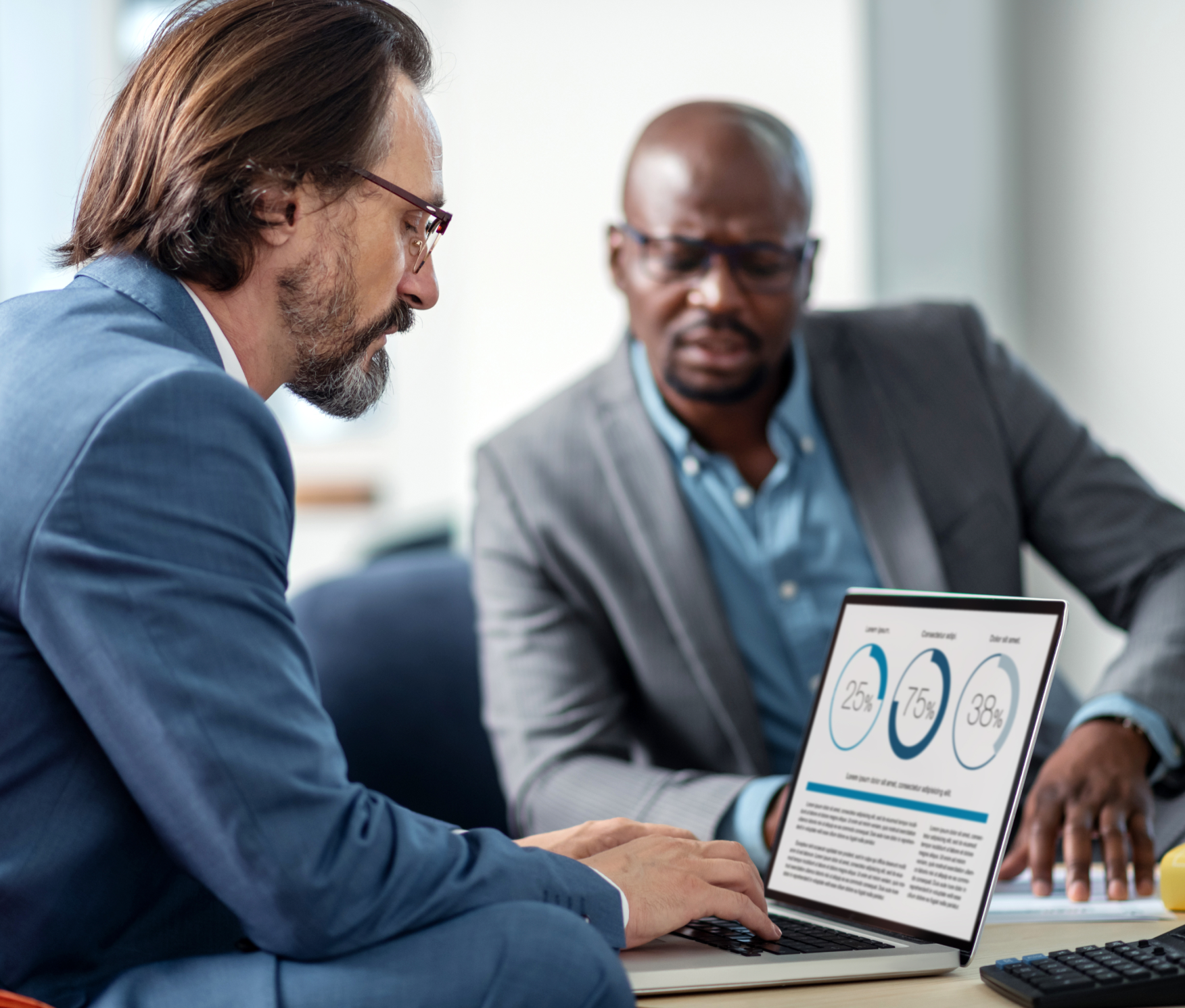 Man and an advisor reviewing charts on a laptop